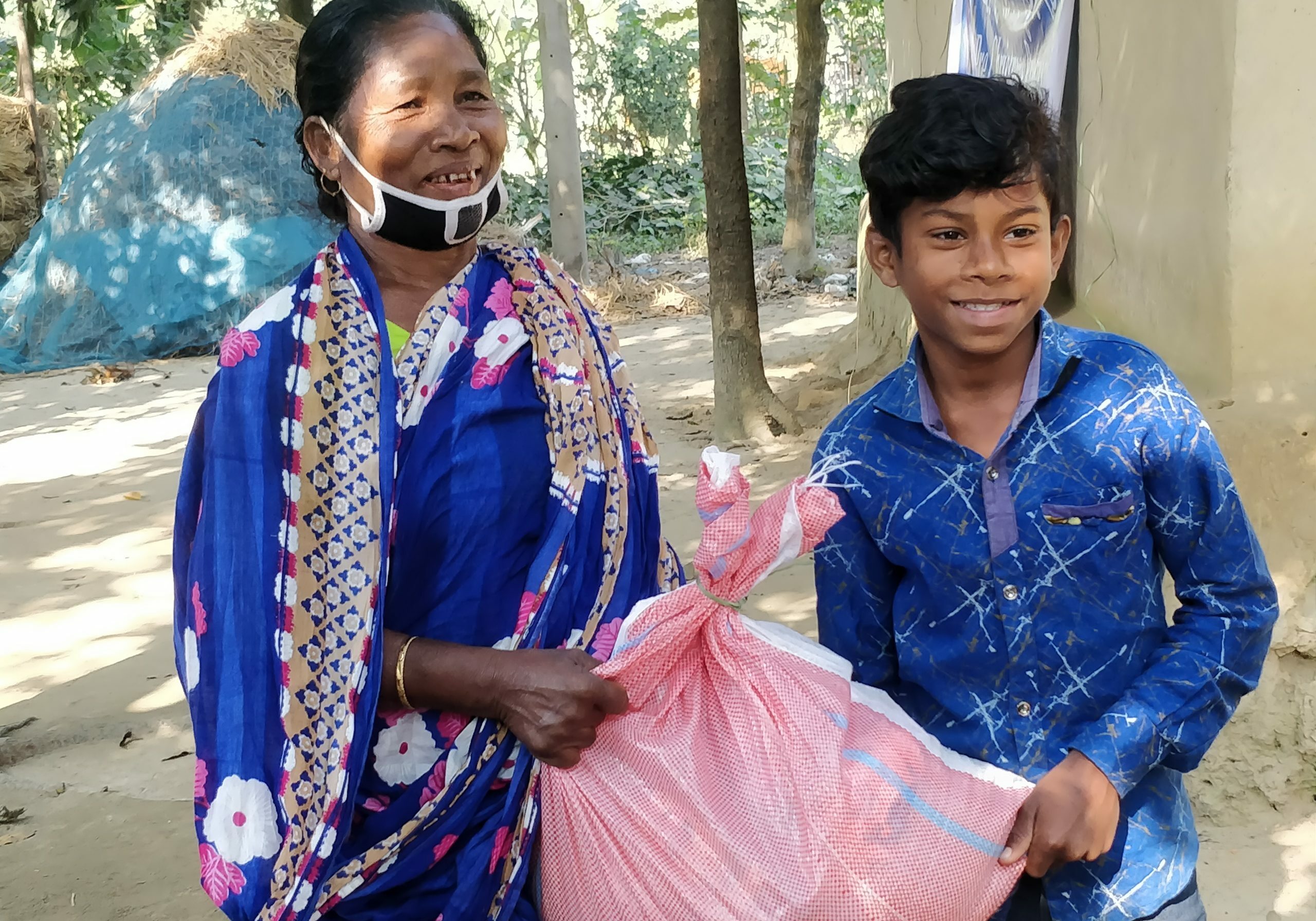 Happily receiving basic food items
